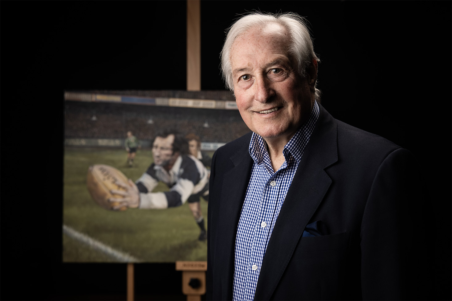 Gareth Edwards standing next to 'The Greatest Try' painting