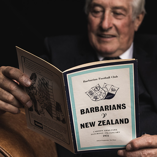 Sir Gareth Edwards reading 1973 Barbarians v New Zealand programme 